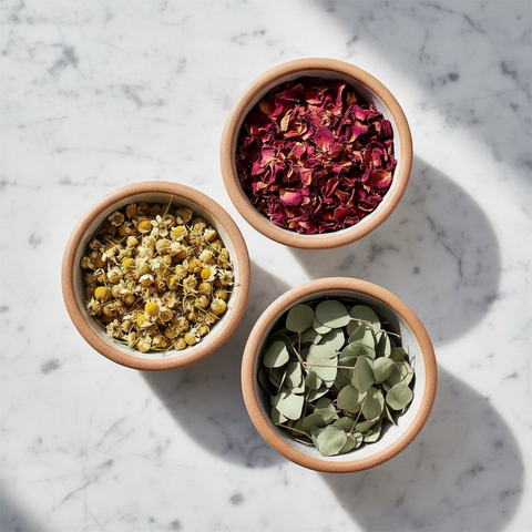 Bowls of bulk herbs on a marble background